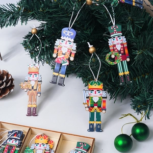 Detailed view of printed wooden nutcracker soldier ornaments on a Christmas tree
