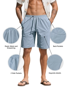 Detail of light blue athletic shorts featuring an elastic waistband and drawstring closure