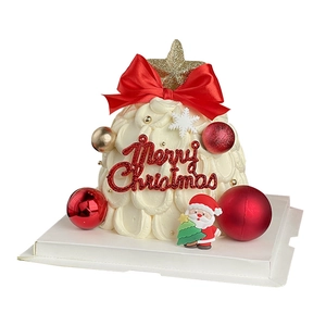 Christmas tree cake topper with Santa figurine and golden star decoration on white tray