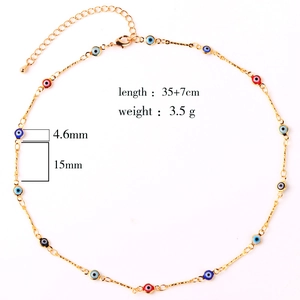 Detail view of gold-plated evil eye necklace with 35+7cm length and 3.5g weight specs