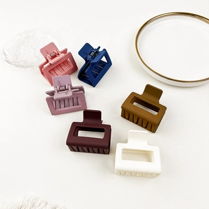 Detailed collection of square matte hair claws in six soft pastel colors for styling