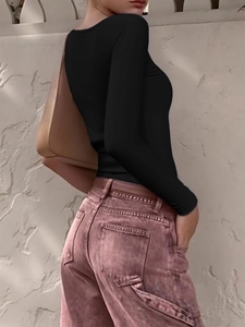 Side view of black slim fit long sleeve top with Y2K style aesthetic on fashion model