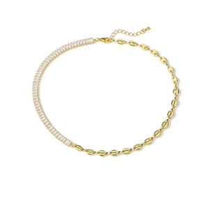 Detail of gold pig nose chain and rectangular zircon tennis chain with lobster clasp