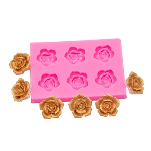 Pink 6-cavity rose silicone mold for chocolate and resin crafting on white background