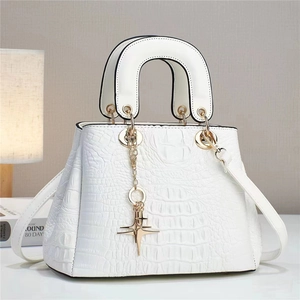 White faux crocodile leather handbag with gold star charm and curved handle for women