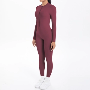 Detailed side view of dark red long sleeve one-piece yoga suit with half-zipper collar