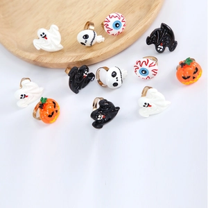 Detail of Halloween ghost and pumpkin ring set with adjustable golden metal bands