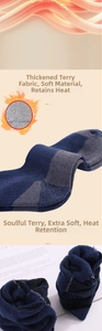 Detail of thickened merino wool hiking socks showing warm loop pile lining in grey and blue