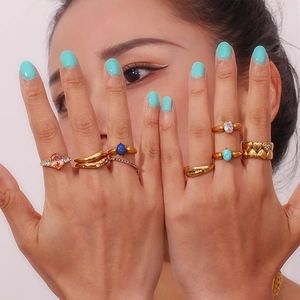 18K gold plated stainless steel ring set with zircon stones on female model hand