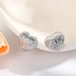 French vintage brushed silver heart stud earrings with minimalist metal texture