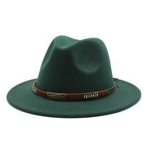 Detail of dark green wide brim fedora with studded brown belt and bronze buckle