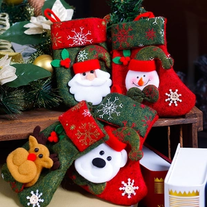 Set of 4 rustic Christmas stockings with Santa, snowman, reindeer and polar bear motifs