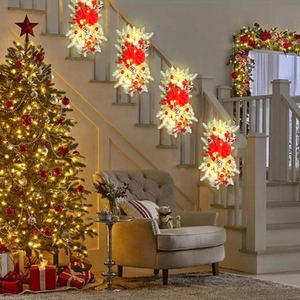 Detail of Christmas stair swag set with warm LED lights and red bows on a banister