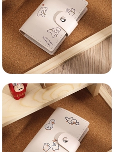 Detail of cream PU leather card holder with cute cartoon bears and metal snap button closure