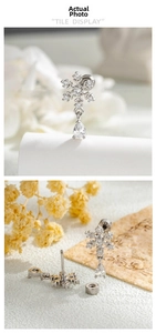 Detail of snowflake earring with zircon drop and secure screw back closure