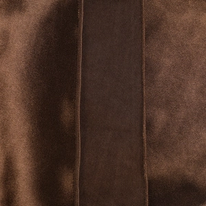 Macro shot of brown satin fabric texture showing fine double-stitch sewing details