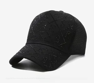 Close-up of black baseball cap with rhinestone lettering and breathable mesh back