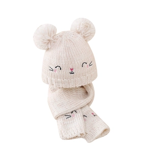 Cute baby winter knit hat and scarf set with pom-poms and cat embroidery in beige