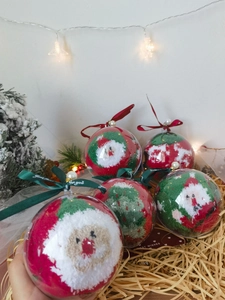 Five pairs of festive Christmas socks in creative spherical gift box packaging