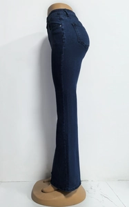 Detail view of deep blue high-waisted flared jeans with side pocket and stretch denim fabric