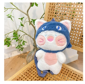Detail of cute shark cat plush backpack on a rattan chair in a cozy room setting