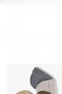 Detail of chunky cable knit texture on thick winter beanie hats in neutral colors