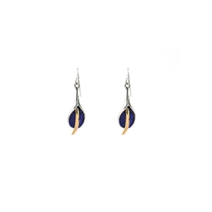 Detailed view of calla lily dangle earrings featuring blue and gold enamel petals