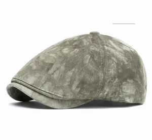 Detail view of the vintage green textured newsboy cap with six-panel stitching design
