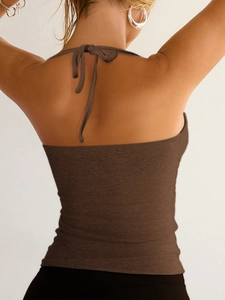 Detail view of brown Y2K halter neck ribbed top showing open back and knit texture