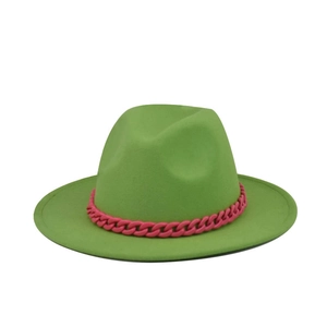Close-up of vibrant green wool fedora hat featuring a bold pink chunky plastic chain detail