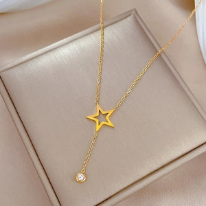 Titanium steel star pendant necklace with cubic zirconia on a beige silk jewelry box