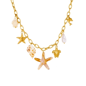 Detailed shot of gold-plated ocean theme necklace with starfish, turtle and dolphin charms