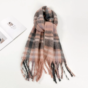 Close-up of thick plaid mohair scarf with pink and grey stripes and long tassels