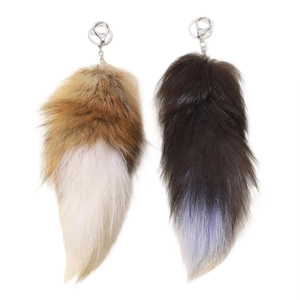 Oversized fluffy faux fox tail keychains in brown and grey with silver lobster clasps