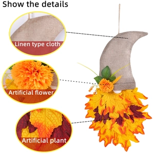 Harvest gnome wreath decoration with autumn maple leaves and linen hat for Thanksgiving
