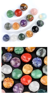 Detailed view of polished natural crystal cat paw carvings in various vibrant mineral stones