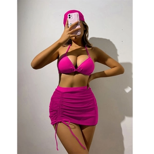 Detail of hot pink three-piece bikini set with drawstring mesh skirt and matching headscarf