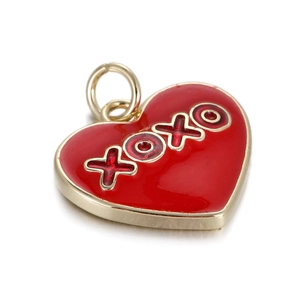 Detail of red enamel heart pendant with golden XOXO lettering and metallic finish