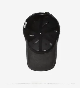 Macro view of vintage black baseball cap interior with stitching and metal buckle