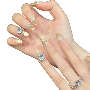 Luxury champagne gold cat-eye press-on nails decorated with sparkling K9 rhinestones