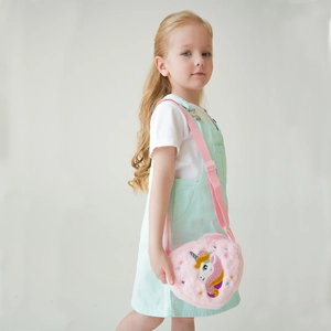 Detail view of kids pink plush unicorn crossbody bag with soft faux fur and embroidery