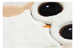 Close-up of soft coral fleece owl hand towel showing high-density absorbent texture