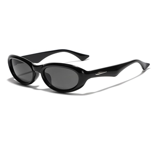 Chic black oval sunglasses with Y2K futuristic vibe and silver metallic temple accents
