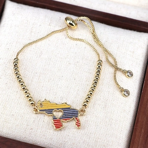 Adjustable golden beaded bracelet with Venezuela map pendant in yellow, blue and red enamel
