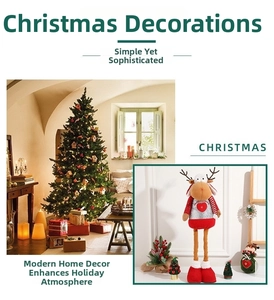 Detail of Christmas reindeer doll with sequin heart vest and mini pine tree decor