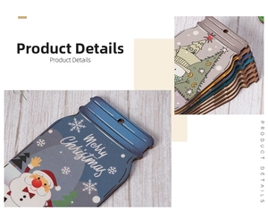 Detail of wooden Christmas jar tags with Merry Christmas print and festive ornaments