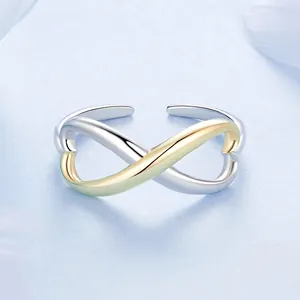 Minimalist infinity symbol open ring in two-tone 925 sterling silver on blue background