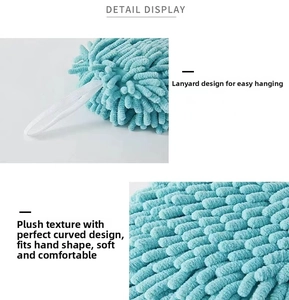 Detail of teal chenille hand towel ball with durable white hanging loop and soft texture