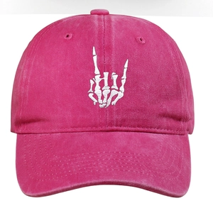 Detail of white claw embroidery on pink washed cotton baseball cap with curved brim