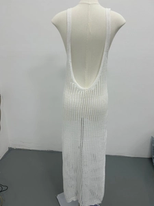 Detailed back view of white crochet maxi dress showing open back and knit texture
